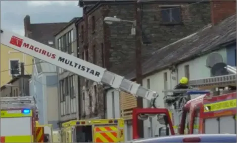  ??  ?? The scene at Market Street on Thursday afternoon when Louth County Council Fire and Rescue Service helped the ambulance service