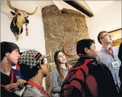  ?? Marcus Yam Los Angeles Times ?? HIGH SCHOOL students take a guided tour led by Amy Lutz, center, at Rancho del Cielo in the Santa Ynez Mountains in Santa Barbara County.