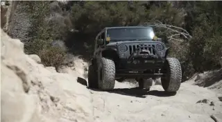  ??  ?? 01. This JKU is built for both overlandin­g
and rock crawling.
02. Off Road evolution bolt-on coilovers were installed in the front and rear and
were paired with MetalCloak adjustable control arms.
03. A Warn 9.5cti winch with wireless remote is nestled on
the front bumper.
01