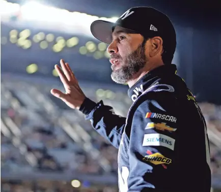  ?? PETER CASEY/USA TODAY SPORTS ?? Jimmie Johnson waves to fans during the Bluegreen Vacations Duels at Daytona on Thursday. Johnson will take a ceremonial trip around the track up before Sunday’s Daytona 500.