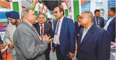  ?? Virendra Saklani/Gulf News ?? Vipul, Consul General of India in Dubai, tours Gitex along with Kamal Vachani, Middle East Director of India’s Electronic­s and Computer Software Export Promotion Council.