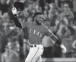  ?? RICHARD W. RODRIGUEZ/TRIBUNE NEWS SERVICE ?? The Texas Rangers' Delino DeShileds reacts after his hit scored Joey Gallo to beat the Kansas City Royals, 1-0, in 13 innings in Arlington, Texas, on Thursday.