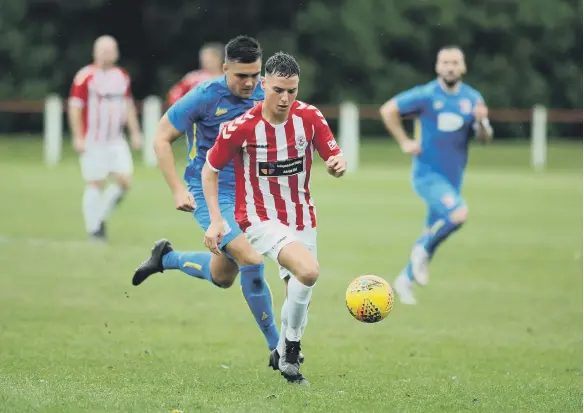  ?? ?? Seaham Red Star in recent action against Sunderland RCA (blue).