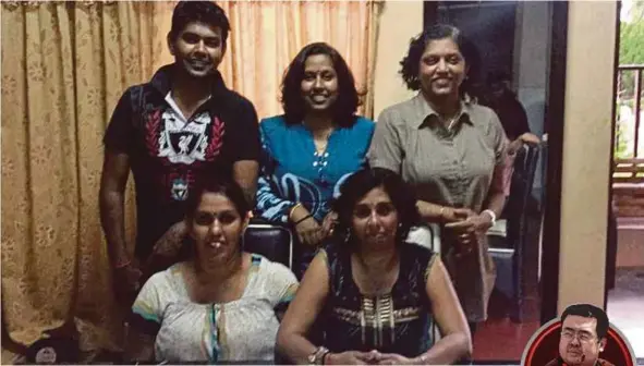  ?? PIC COURTESY OF FAMILY ?? A photo showing S. Komala Theinmoli (seated, left) and her sister, Nirmala Malar Kodi (standing, right) at their home in Kuala Kangsar, Perak.