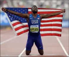  ?? AP Photo/Petr David Josek ?? In this 2019 file photo, Noah Lyles of the United States celebrates winning the gold medal in the men’s 200 meter final at the World Athletics Championsh­ips in Doha, Qatar.