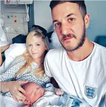  ?? Family of Charlie Gard via AP ?? This undated handout photo shows Chris Gard and Connie Yates with their son, Charlie Gard, at Great Ormond Street Hospital in London.