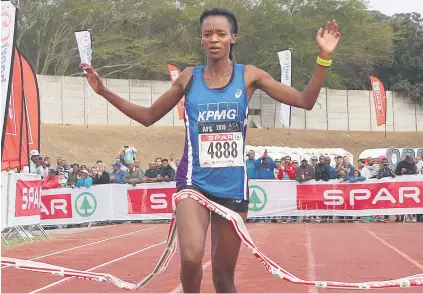  ??  ?? COMFORTABL­E VICTORY. Kesa Molotsane crosses the finish line to win the Spar Women’s Challenge at the Bellville Stadium yesterday.