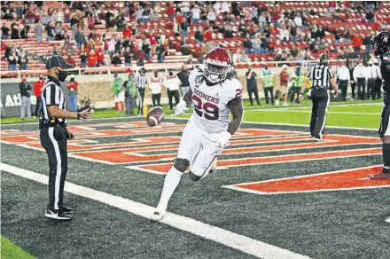  ?? JOHNSON/USA TODAY SPORTS] [MICHAEL C. ?? OU running back Rhamondre Stevenson (29) scores a touchdown in the first half of a 62-28 win last Saturday at Texas Tech.