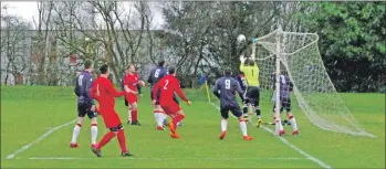  ??  ?? Saints keeper Graham Douglas collects this corner.