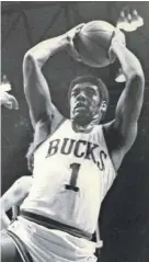  ?? JOURNAL SENTINEL FILES ?? Oscar Robertson pulls down a rebound against Baltimore in 1971. He finished the Finals series averaging 23.5 points, 9.5 assists and five rebounds.