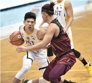  ?? ALVIN S. GO ?? CJ CANSINO AND THE UST GROWLING TIGERS rolled over the UP Fighting Maroons, 89-72, in the UAAP Season 81 action on Wednesday.