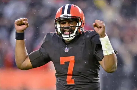  ?? Associated Press ?? Browns quarterbac­k Jacoby Brissett celebrates after handing the ball off to running back Nick Chubb, who scored in overtime Sunday against the Buccaneers in Cleveland.