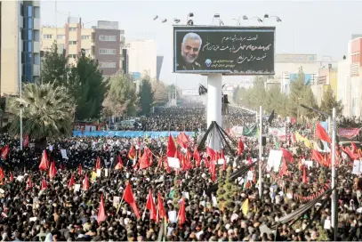  ?? Picture: Reuters ?? MOURNED. Iranian people yesterday attend a burial for Major-General Qasem Soleimani, head of the elite Quds Force, who was killed in an air strike at Baghdad airport, at his hometown in Kerman.