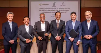 ?? ?? (From left) Gentari head of renewables for Malaysia and Southeast Asia Sy Malek Faisal Sy Mohamad, Aadrin, Albern, Mohd Yusri, Shah Yang Razalli, and CelcomDigi’s chief enterprise business officer Afizulazha Abdulla at the MoU signing ceremony between Petronas and CelcomDigi.