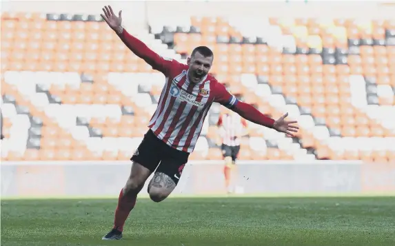  ??  ?? Max Power celebrates his goal against Oxford.