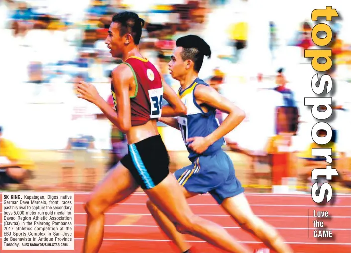  ?? ALEX BADAYOS/SUN.STAR CEBU ?? 5K KING. Kapatagan, Digos native Germar Dave Marcelo, front, races past his rival to capture the secondary boys 5,000-meter run gold medal for Davao Region Athletic Associatio­n (Davraa) in the Palarong Pambansa 2017 athletics competitio­n at the EBJ...