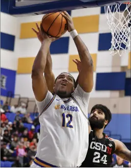  ?? PHOTO BY MILKA SOKO ?? UC Riverside’s Jhaylon Martinez gets inside of Cal State Northridge’s Jasman Sangha for an easy basket during Saturday’s Big West Conference game at UCR.