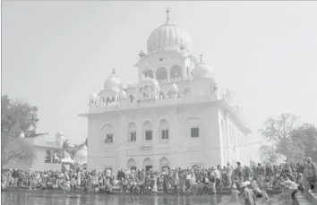 ??  ?? SIKH devotees take a dip in the sarover (water tank) at Gurdwara Chheharta Sahib, some 7km west of Amritsar, yesterday, on the occasion of Basant Panchami. Basant Panchami, the Festival of Spring,
is celebrated mainly in Haryana and Punjab. — AFP