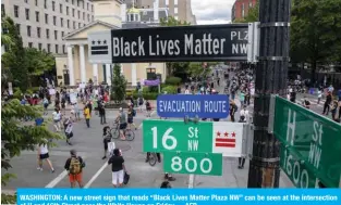  ?? AFP ?? WASHINGTON: A new street sign that reads “Black Lives Matter Plaza NW” can be seen at the intersecti­on of H and 16th Street near the White House on Friday.—