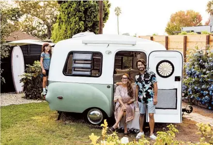  ?? BETH COLLER/THE NEW YORK TIMES ?? Stacie Krajchir-Tom, with her husband, Kristopher, and her son, Milo, Oct. 6 in California.