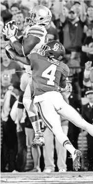  ?? KEVIN JAIRAJ, USA TODAY SPORTS ?? Ohio State’s Noah Brown makes one of his four touchdown catches in Saturday’s win.