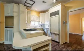  ?? ?? The kitchen provides ample cabinetry and top-of-the-line stainless steel appliances.