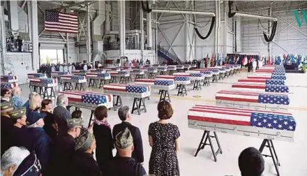  ?? REUTERS PIC ?? Caskets containing the remains of American servicemen from the Korean War handed over by North Korea arriving at Joint Base Pearl Harbour-Hickam in Honolulu, Hawaii, on Wednesday.