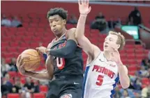  ?? DUANE BURLESON/AP ?? Miami’s Josh Richardson (0) grabs a rebound against Detroit’s Luke Kennard during the second half on Sunday.