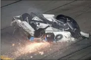  ?? DAVID GRAHAM - THE ASSOCIATED PRESS ?? Ryan Newman slides down the track after he was involved in a crash on the final lap of the NASCAR Daytona 500 auto race at Daytona Internatio­nal Speedway, Monday, Feb. 17, 2020, in Daytona Beach, Fla. Sunday’s race was postponed because of rain.