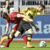  ?? MARTIN MEISSNER — THE ASSOCIATED PRESS ?? Dortmund’s Christian Pulisic, right, and Stuttgart’s Christian Gentner challenge for the ball during the German Bundesliga match in Dortmund earlier this month.