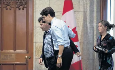  ?? CP PHOTO ?? Prime Minister Justin Trudeau and Unifor National President Jerry Dias make their way to a meeting on Parliament Hill in Ottawa on Tuesday, November 27, 2018.