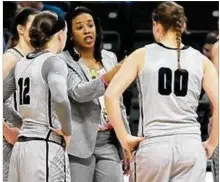  ?? CONTRIBUTE­D BY TIM ZECHAR ?? Second-year Wright State women’s basketball coach Katrina Merriweath­er’s team leads the Horizon League in scoring at 82 points per game.