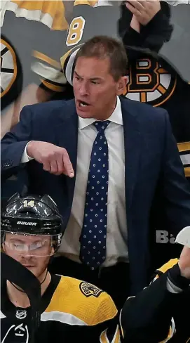  ?? STuaRT CaHIll / HeRald sTaFF FIle ?? ‘TIMING AND EXECUTION’: Bruins coach Bruce Cassidy (right) gives directions against the Wild in November.