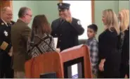  ?? NICHOLAS BUONANNO- DIGITAL FIRST MEDIA ?? Cohoes firefighte­r George Primeau Jr. takes the oath of office for his promotion to lieutenant.