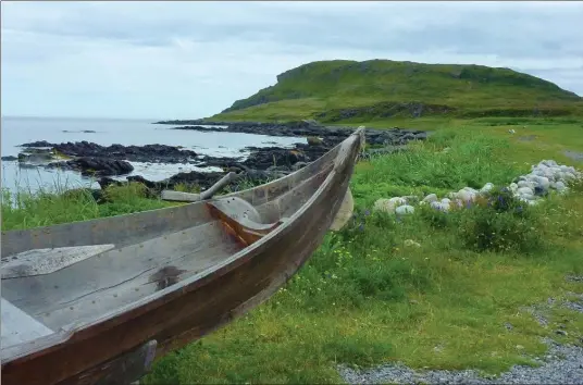  ?? PHOTOS BY MARY K. NOLAN, SPECIAL TO THE HAMILTON SPECTATOR ?? A replica of a small Viking boat sits on the shore at Norstead Village, a re-created Viking port of trade near L’Anse aux Meadows National Historic Site.