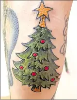  ??  ?? James O’keeffe also decided to get a festive tattoo, opting for a Christmas tree