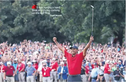  ?? AFP ?? Woods celebrates making a par on the 18th green to win the Tour Championsh­ip at the East Lake Golf Club in Atlanta, Georgia. —