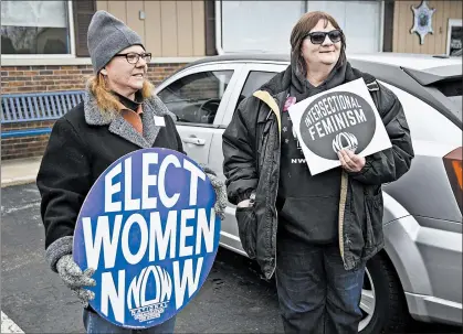  ?? MICHAEL GARD/POST-TRIBUNE ?? Deb Chubb, left, of Michigan City, is on the Indiana board for the National Organizati­on for Women. Julie Storbeck, right, is president of Northwest Indiana NOW. They protested outside a mobile office used by a staff member of U.S. Sen. Mike Braun on Jan. 15, 2020.