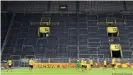  ??  ?? Borussia Dortmund's famous South Stand has largely remained empty during the pandemic