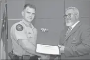  ?? GNTC ?? Joseph Taylor (left) accepts the Top Gun award for excellence in marksmansh­ip from Jim Pledger, program director and instructor of GNTC’S Law Enforcemen­t Academy.