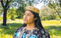  ?? CHARLIE NEUMAN FOR THE U-T ?? Pauma tribal member Cynthia Bond, 21, wears traditiona­l regalia she will also wear when she competes for Miss Indian World.