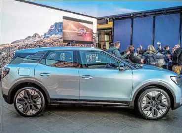  ?? /Bloomberg ?? Accelerati­ng: Ford’s Explorer electric SUV during its launch in London, UK, on Tuesday. Ford Motor predicts that losses in its EV business will be $3bn in 2023, double what it lost in the two previous years combined.