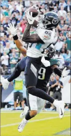  ?? Mark Zaleski ?? The Associated Press Titans receiver Corey Davis catches the game-winning 10-yard touchdown pass over Eagles cornerback Avonte Maddox with five seconds left in overtime Sunday in Nashville, Tenn.