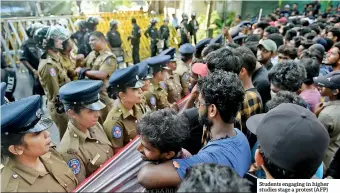  ??  ?? Students engaging in higher studies stage a protest (AFP)