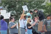  ?? kevin Myrick ?? Dozens of people join in a demonstrat­ion on Main Street in downtown Cedartown on Tuesday. It was the first large group to have gathered to protest in Polk County following the death of George Floyd last week.