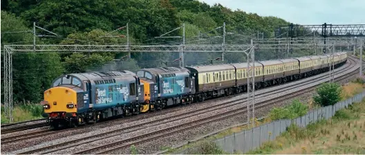 ?? Brad Joyce ?? What does the future hold for DRS charter operations – or indeed the ageing Class 37 fleet? 37069 and 37716 pass Slindon hauling 1Z39, the Pathfinder Tours ‘The Blue Boys Merrymaker’, from Bescot Yard to Crewe on August 7, 2021.