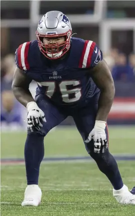  ?? AP FILE ?? STATUS UP IN THE AIR: Left tackle Isaiah Wynn (76) and left guard Mike Onwenu are still on the COVID-19 reserve list.