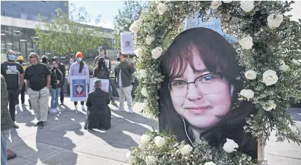  ?? ?? UNINTENDED VICTIM: A photo of 14-year old Valentina Orellana Peralta, who was killed by a stray police bullet while shopping at a clothing store, is shown outside the LAPD headquarte­rs in Los Angeles.