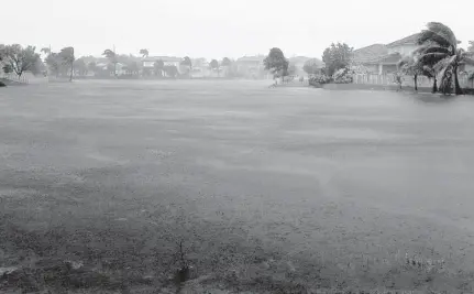  ??  ?? Rain and winds on the lake community of Monarch Lakes in West Miramar in 2017. Strong winds and rain from Hurricane Irma downed trees, branches and mail boxes at Monarch Lakes.
SOUTH FLORIDA SUN SENTINEL FILE