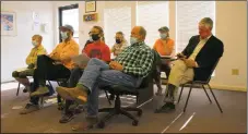  ?? MICHAEL TASHJI/Taos News ?? From left: Brad McCaslin, Village of Angel Fire Chief of Police, explains his role in policing recreation­al cannabis. Angel Fire residents participat­e in a town hall meeting on a new cannabis ordinance Monday (Sept. 13).